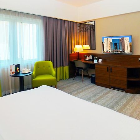 The Grand Lux Hotel ドーハ エクステリア 写真 A room at the hotel