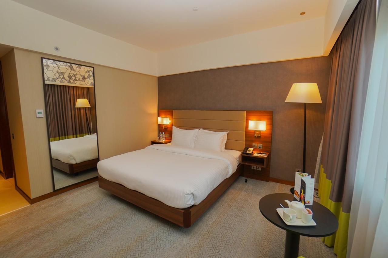 The Grand Lux Hotel ドーハ エクステリア 写真 A room at the hotel