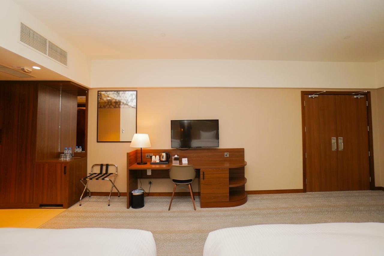The Grand Lux Hotel ドーハ エクステリア 写真 A room at the hotel