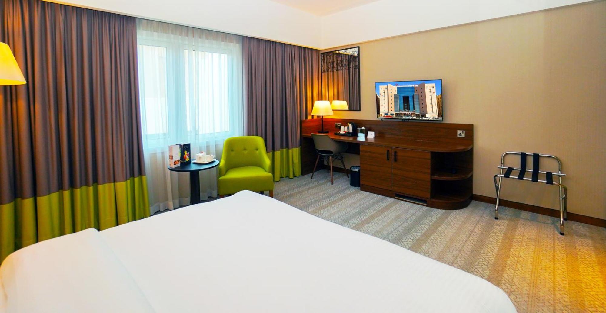 The Grand Lux Hotel ドーハ エクステリア 写真 A room at the hotel